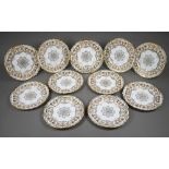 A set of eleven Edwardian Coalport china 22.5 cm plates, finely gilded with cornucopiae, scrolls,