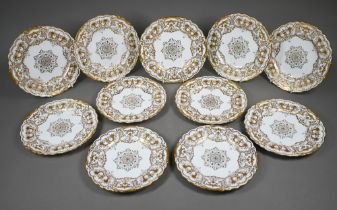 A set of eleven Edwardian Coalport china 22.5 cm plates, finely gilded with cornucopiae, scrolls,