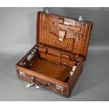 An Edwardian leather suitcase with silver-mounted and other fittings, Thomas Jones Watson, London