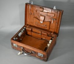 An Edwardian leather suitcase with silver-mounted and other fittings, Thomas Jones Watson, London