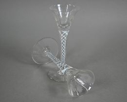 A pair of Jacobite-style cordial glasses, the flared bowls wheel-etched with roses and buds, on