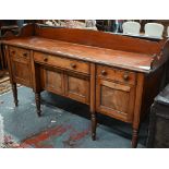 A Victorian mahogany 3/4 galleried sideboard, with an arrangement of three drawers and centred by