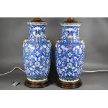 A pair of 19th century Chinese 'longevity' vases  painted with shou symbols and floral designs in