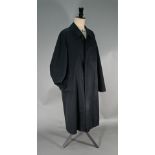 Burberry's gentleman's long black gabardine car coat with traditional check lining and detachable