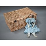 A 19th century wax-headed girl-doll with brown wig and fixed brown eyes, on stuffed fabric body with