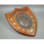 A large oak trophy shield for the Aberdare Quoit Association, with central copper plaque embossed