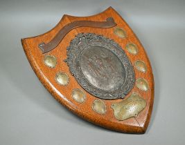 A large oak trophy shield for the Aberdare Quoit Association, with central copper plaque embossed