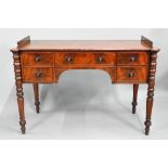 A Victorian kneehole five drawer sideboard, the top with raised gallery sides (back missing) and