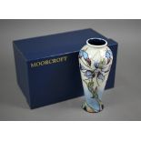 A boxed Moorcroft 'Petals in the Wind' vase by Nicola Slaney, 20.5 cm high