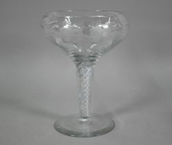 A large glass goblet with vine-etched bowl on airtwist stem, ground out pontil to base, 30 cm high x