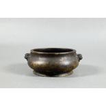 An 18th/19th century Chinese gilt bronze censer or compressed globular form on circular foot cast