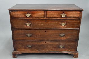 A Georgian mahogany chest of two short over three long graduated drawers, with brass fittings, on