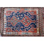 An antique Southern Caucasus rug, the blue ground with twin lozenge pole design, 135 cm x 90 cm