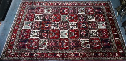 An old Persian Bakhtiar tile design rug, with differing floral motifs,  240 cm x 150 cm