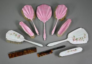A basse-taille and floral enamelled silver four-piece brush set including hand-mirror and comb (