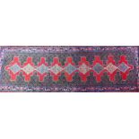 A contemporary North West Persian Senneh runner, the lozenge pole design on red ground, 300 cm x 100