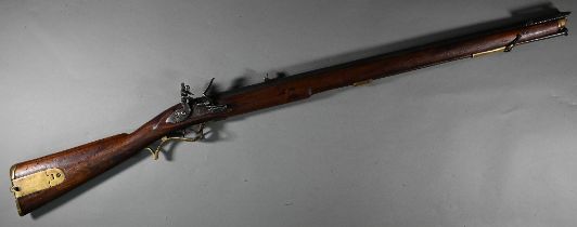 A replica Georgian flintlock 'Brown Bess' musket, the 78.5 cm barrel with bayonet mounting-clip,