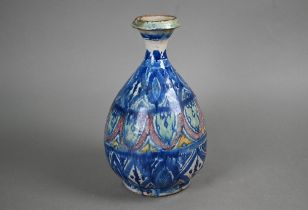 A majolica pear-shaped vase with flared neck decorated in the Isnic manner in blue, green, red and