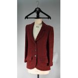 A Chanel Boutique fitted burgundy jacket in wool and mohair, long line, single breasted with two low