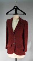 A Chanel Boutique fitted burgundy jacket in wool and mohair, long line, single breasted with two low