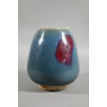 A Chinese Jun Yao style lotus bud vase evenly covered with a crackled turquoise glaze with large