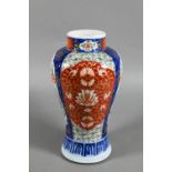 A 19th century Japanese Imari baluster vase, painted in polychrome enamels with landscapes, mythical