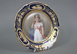 A 19th century Vienna porcelain wall-plate painted with portraits of a lady, 'Luise', within a