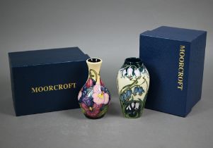 A boxed Moorcroft 'Combermere' vase, 13.5 cm to/w another boxed Moorcroft floral-design vase, 13.5