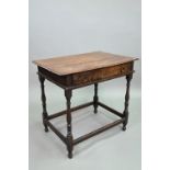 An 18th century oak side table with single drawer, raised on a turned frame united by all-round