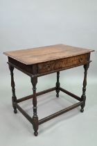 An 18th century oak side table with single drawer, raised on a turned frame united by all-round