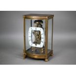 An unusual four window brass framed skeleton clock with open oval white enamelled dial, the single