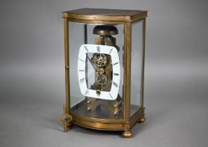 An unusual four window brass framed skeleton clock with open oval white enamelled dial, the single