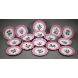 A Victorian china fruit service with floral specimen painted centres with pink and gilt borders,