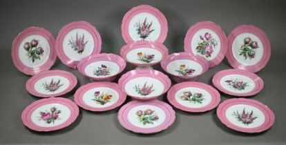 A Victorian china fruit service with floral specimen painted centres with pink and gilt borders,