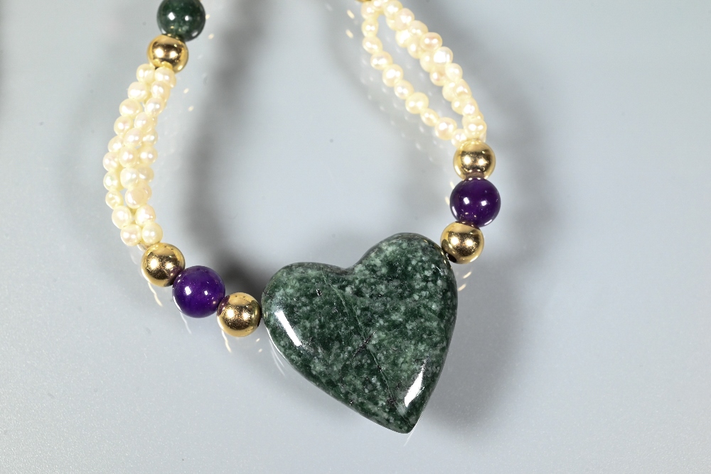 A pearl necklace comprising a triple row of river pearls with hardstone beads and heart to centre, - Image 2 of 5