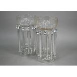 A large pair of cut glass vases, hung with facetted beads and lustres, on hollow knop stems with