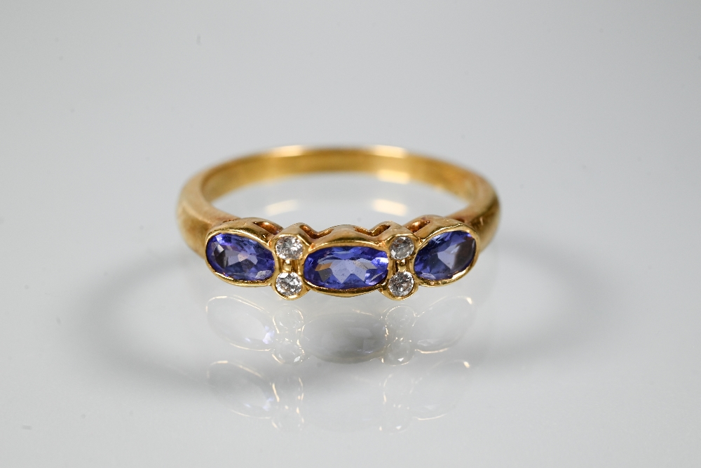 An 18ct yellow gold ring set with three oval blue sapphires with two diamonds between, size P to/w a - Image 6 of 6