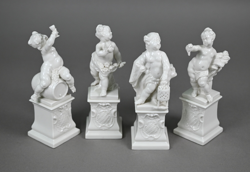 A set of four Nymphenburg white-glazed putti on plinths - The Four Seasons, 17 cm high (4)