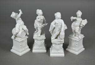 A set of four Nymphenburg white-glazed putti on plinths - The Four Seasons, 17 cm high (4)