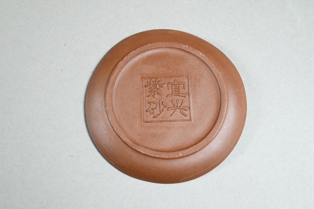 A boxed Chinese Yixing pottery tea set comprising a compressed globular teapot and cover with - Image 4 of 7