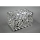 A late 19th/early 20th century Burmese pierced silver (unmarked) box with hinged cover, richly