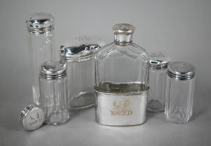 Three cut glass silver-topped toilet jars and a spare lid, London 1892, engraved with initials and
