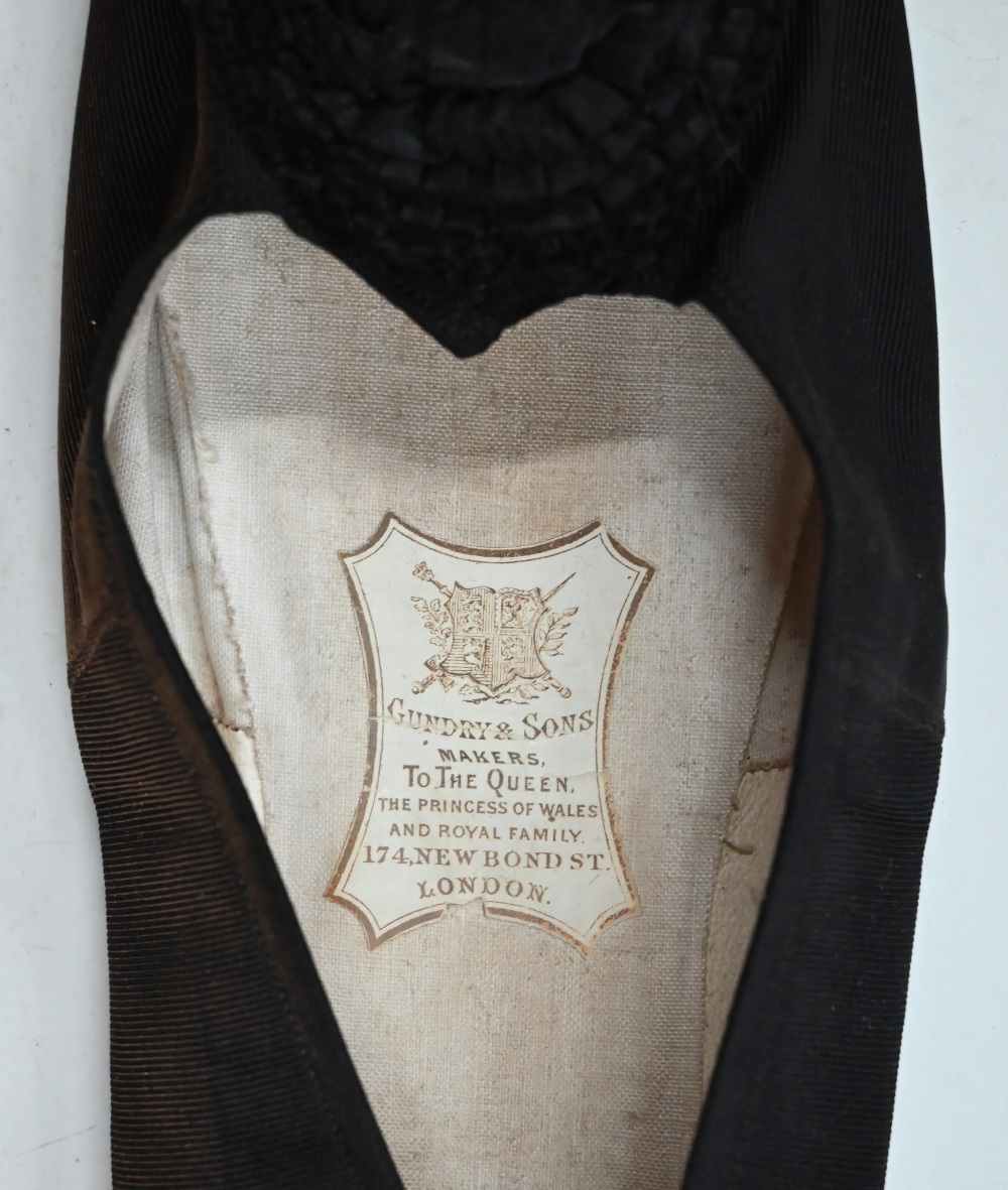 A pair of black silk stockings, the property of Queen Victoria, with drawn thread crowned 'VR' - Image 8 of 8