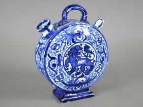 A 19th century Continental blue and white tin-glazed chevrette (water-carrier) of moon-flask form,