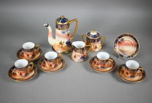 A Noritake china coffee service, painted with dessert oasis scenes, comprising coffee pot, cream and
