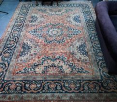 An Indo-Persian Tabriz carpet, the blue/coral ground centred by a floral medallion