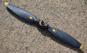 A Vintage Avro Anson aircraft twin blade propeller, black finish with yellow tips, marked 'DA 902'