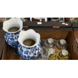 A harlequin set of eight silver resist-ground coffee cups and saucers with chinoiserie decoration