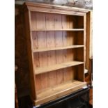 A shallow waxed pine open bookcase, 91 cm w x 23 cm x 122 cm h