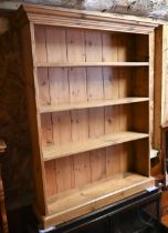 A shallow waxed pine open bookcase, 91 cm w x 23 cm x 122 cm h